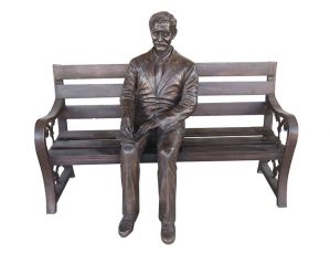 Cast bronze life size one man sits on a bench